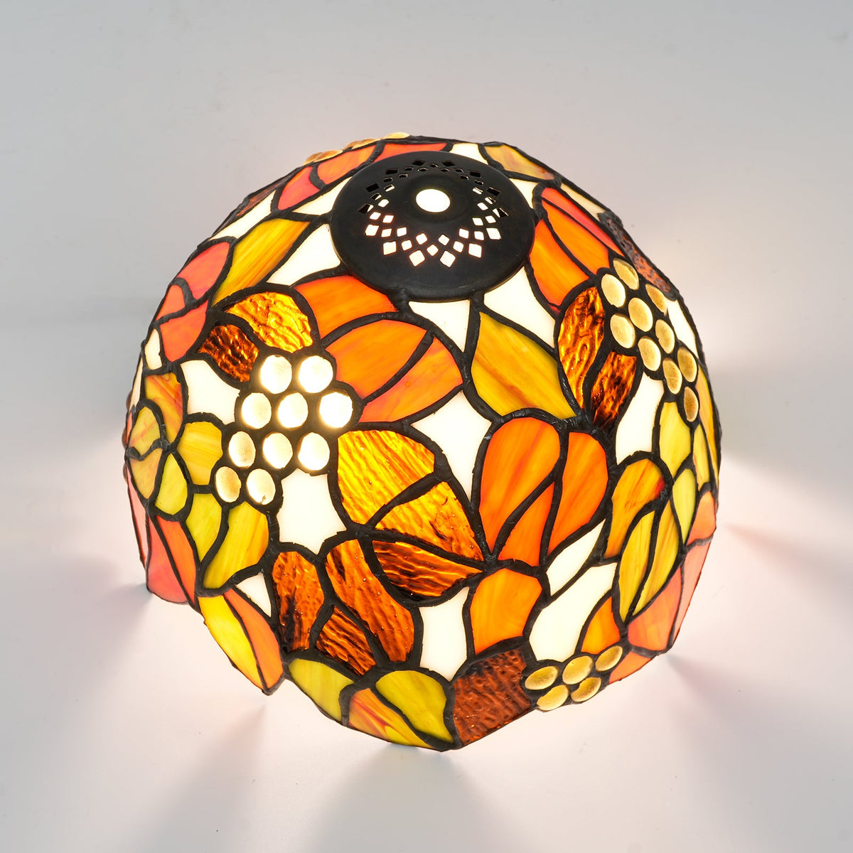 Tiffany stained glass lampshade, floral motif and amber cabochons