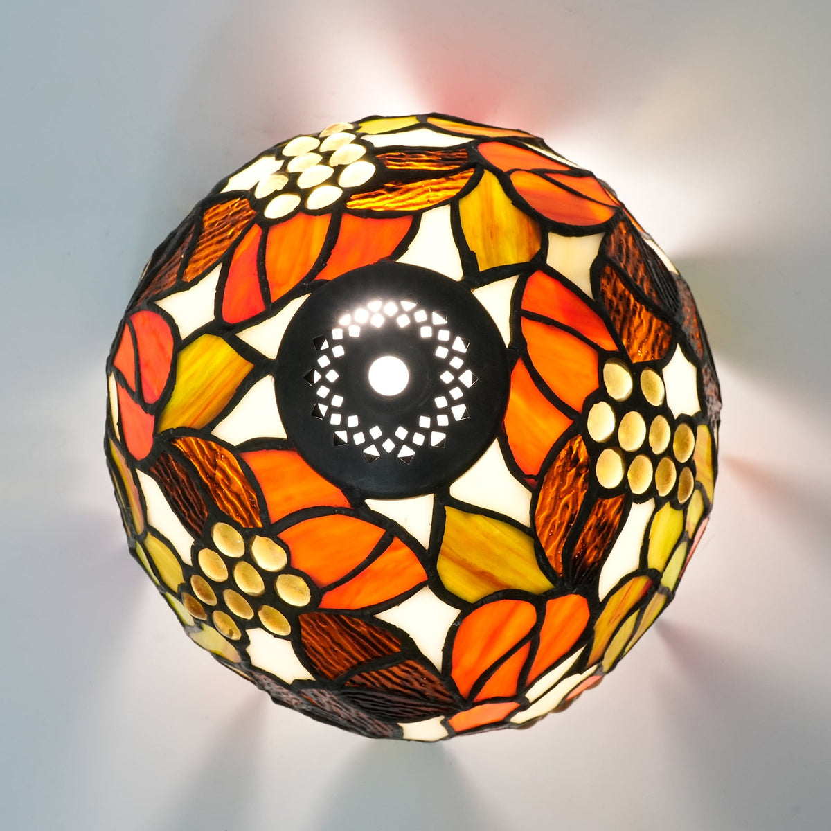 Tiffany stained glass lampshade, floral motif and amber cabochons