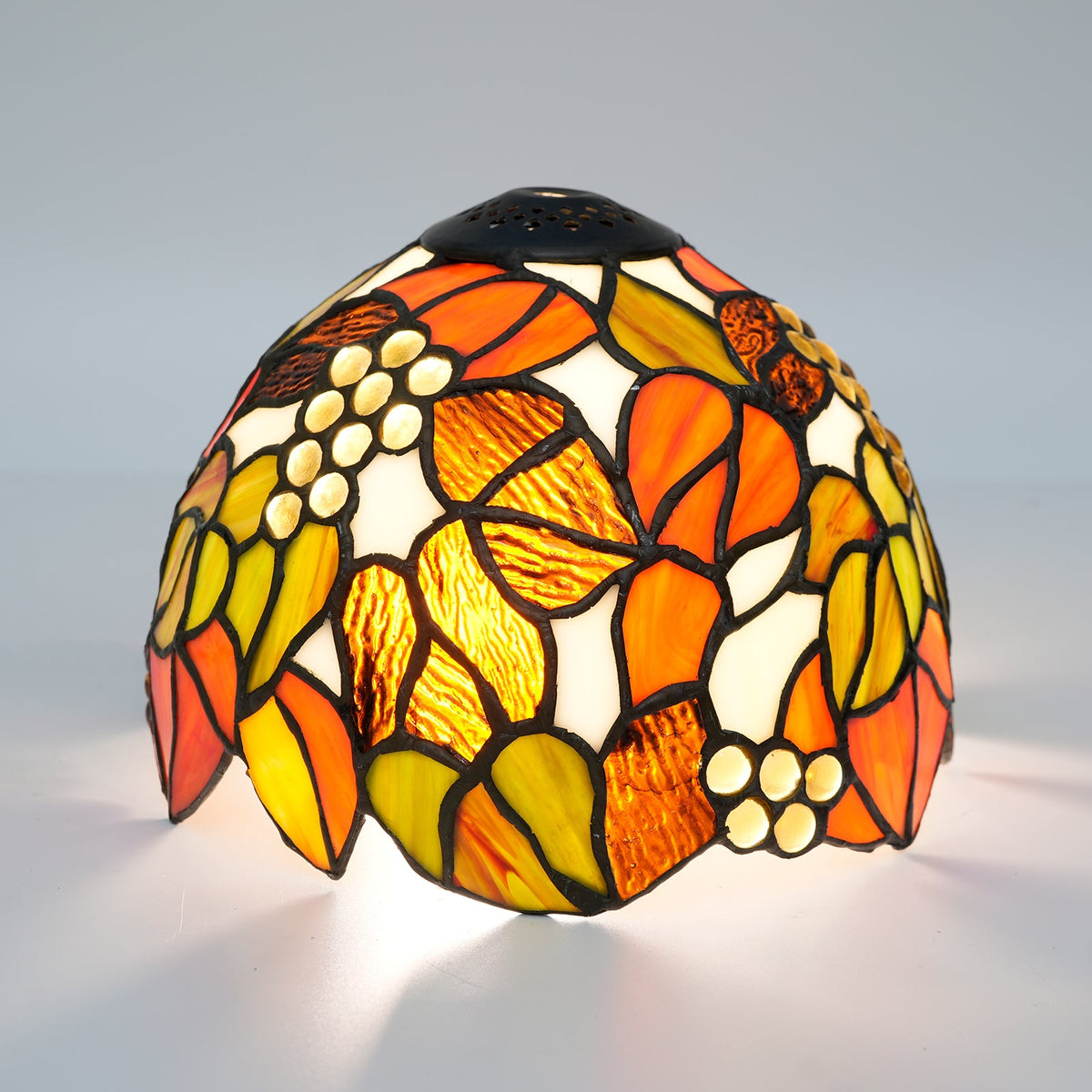 Tiffany stained glass lampshade, floral motif and amber cabochons