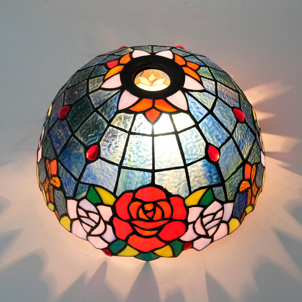 Tiffany-style tinted glass lampshade with a rose pattern