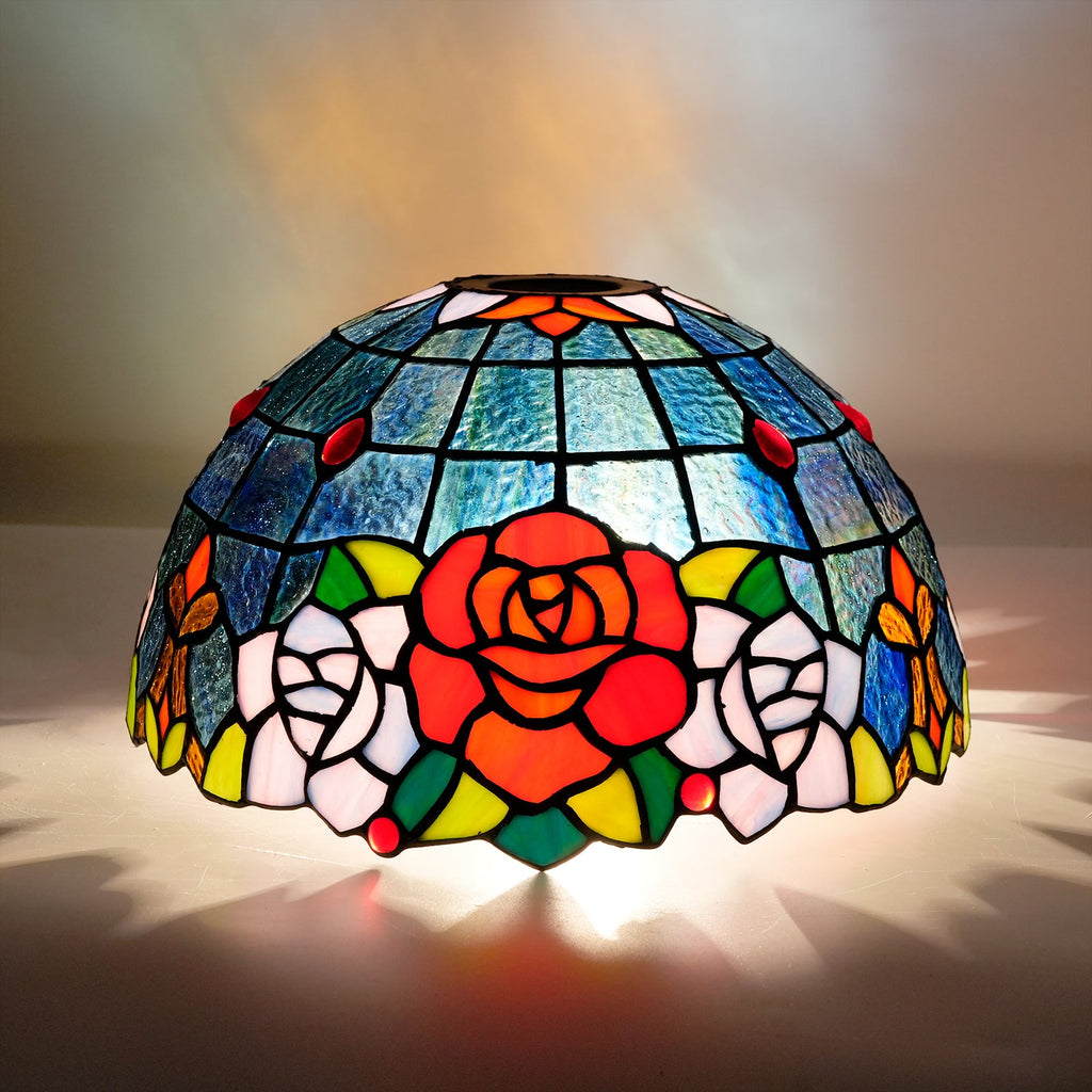 Tiffany-style tinted glass lampshade with a rose pattern