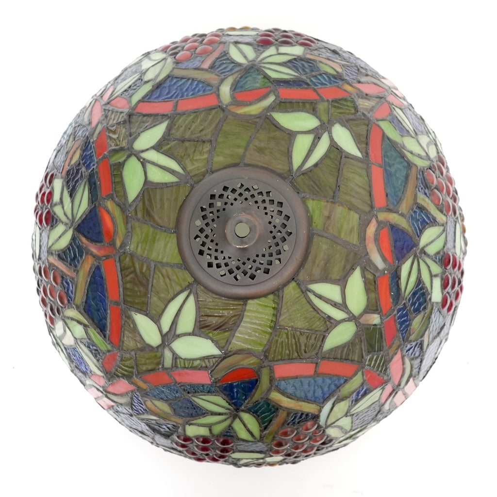 Tiffany-style lampshade in tinted glass with a grape motif