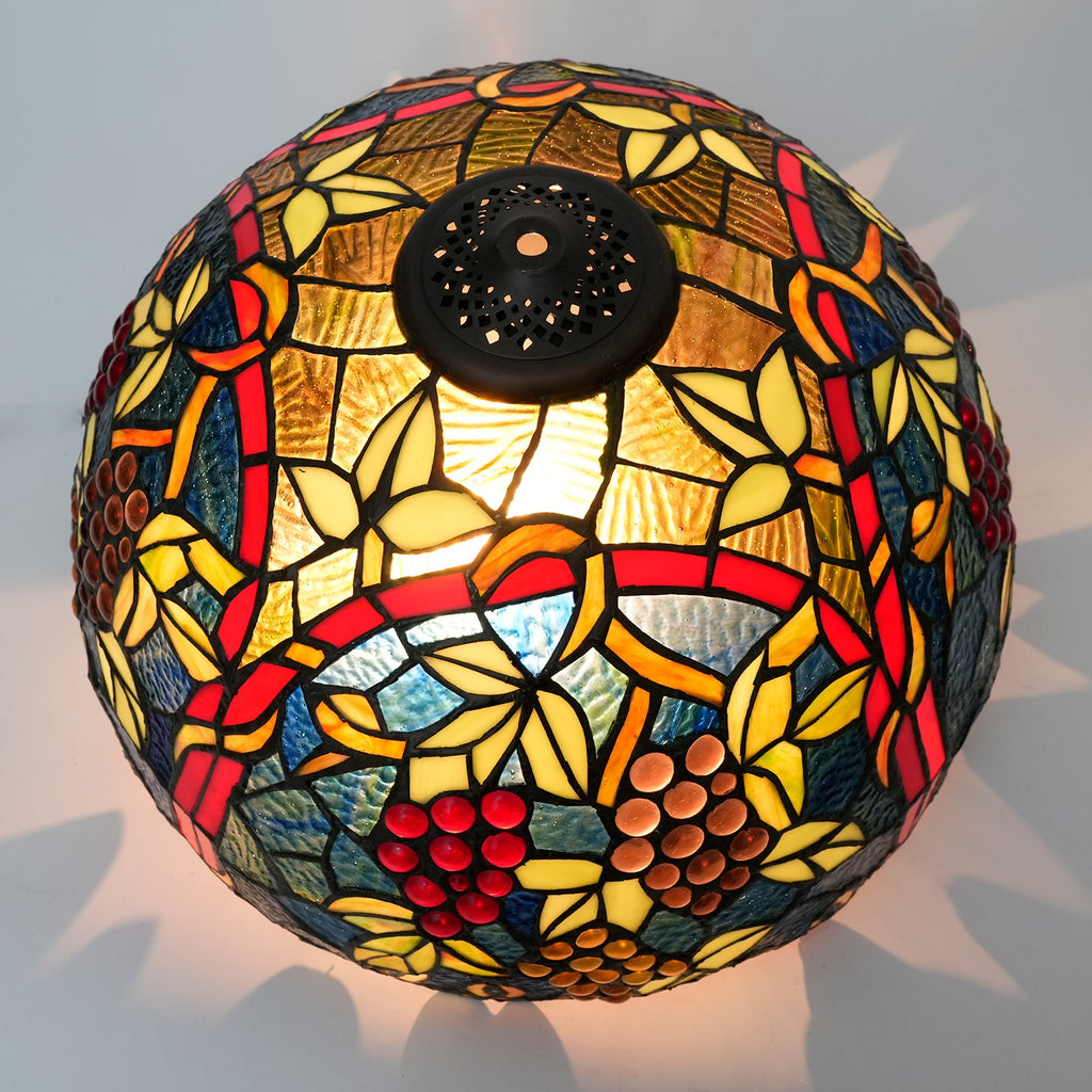 Tiffany-style lampshade in tinted glass with a grape motif