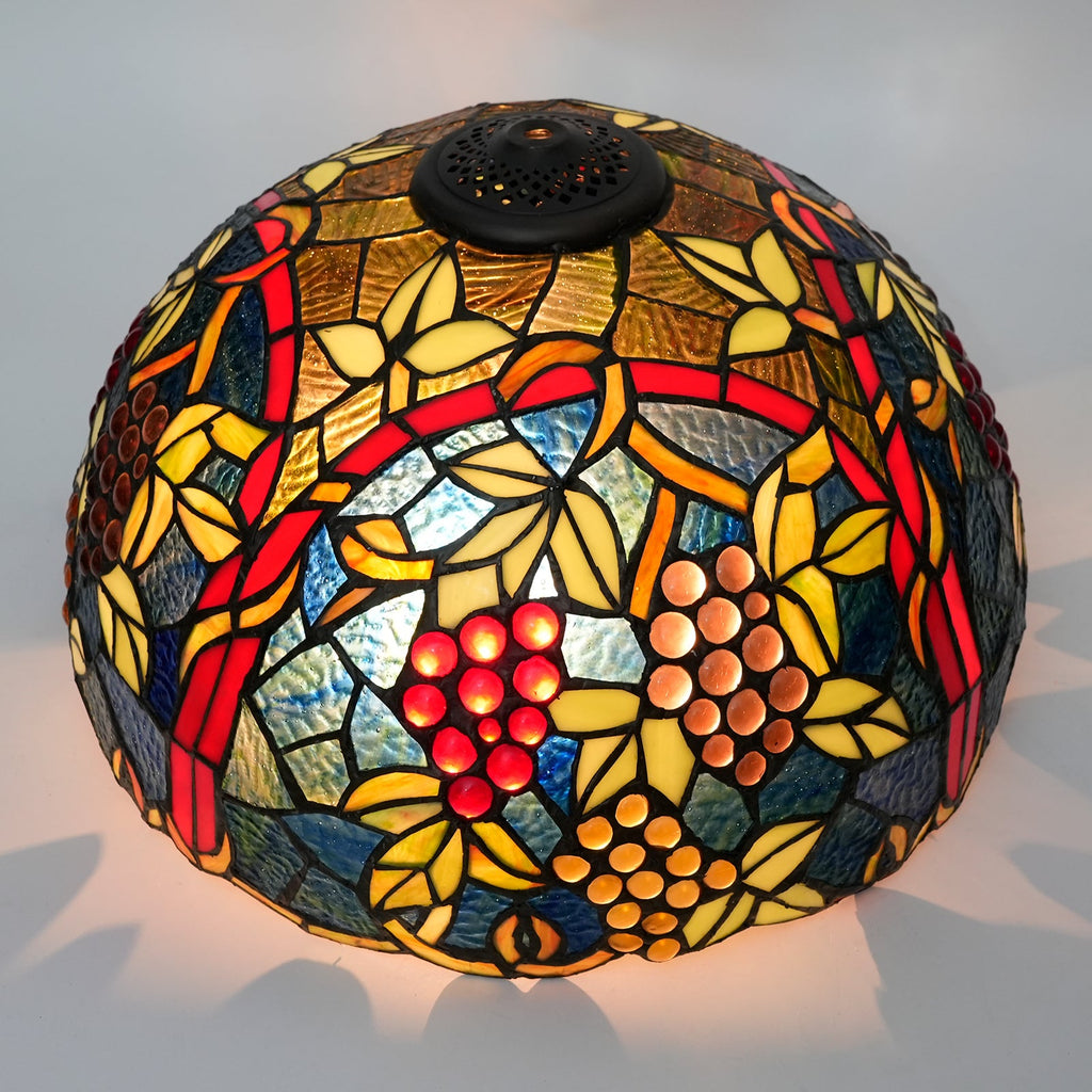 Tiffany-style lampshade in tinted glass with a grape motif