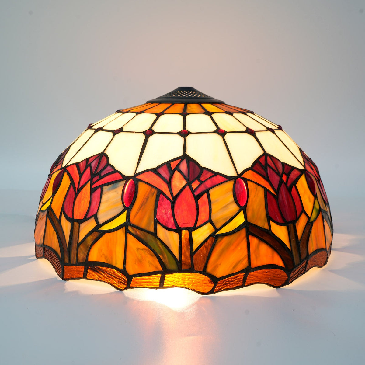 Tiffany-style lampshade in tinted glass with amber tulip patterns