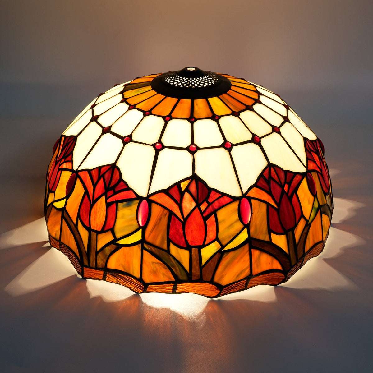Tiffany-style lampshade in tinted glass with amber tulip patterns