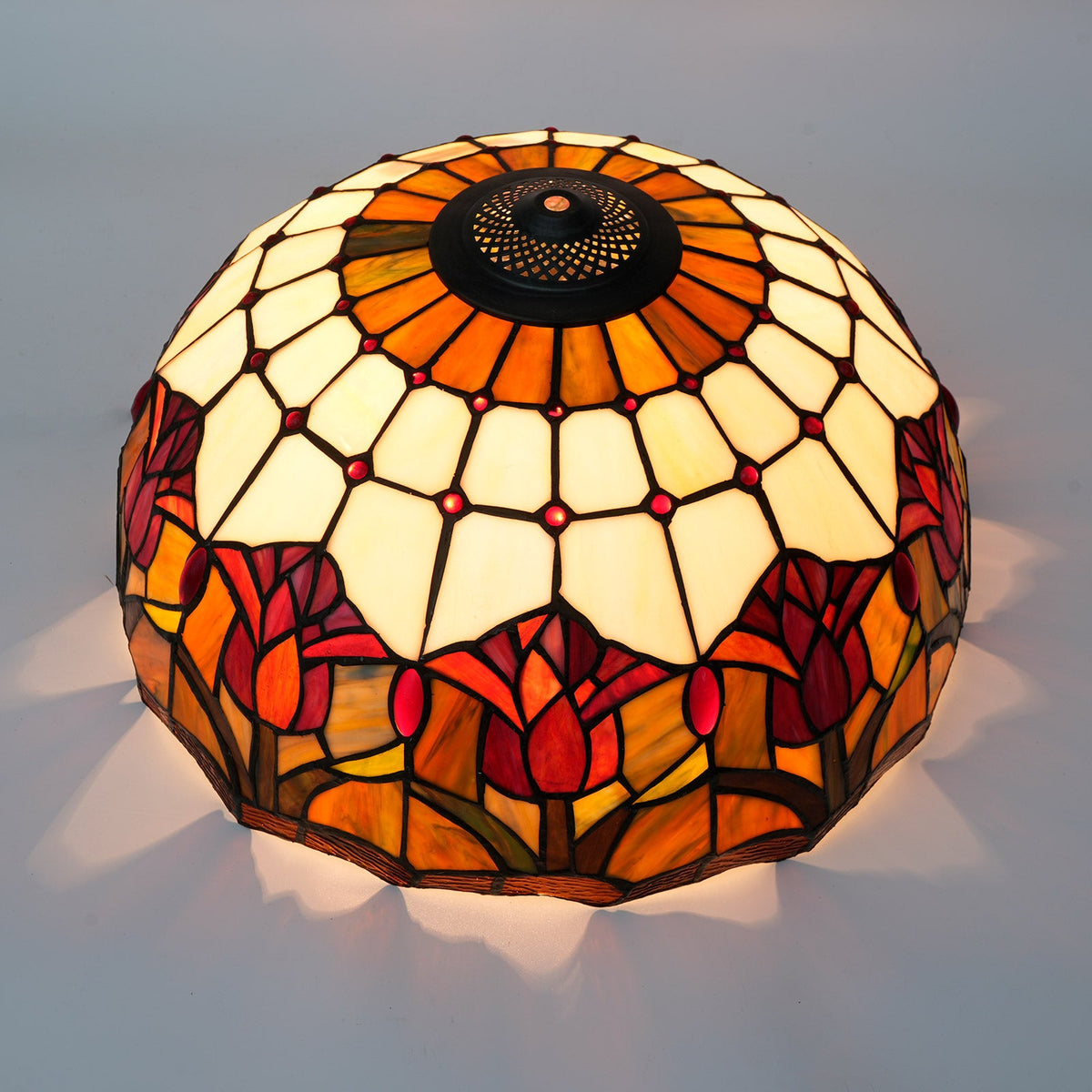 Tiffany-style lampshade in tinted glass with amber tulip patterns