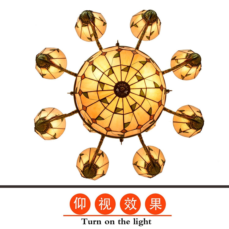 Tiffany-style chandelier in ornate bronze and stained glass