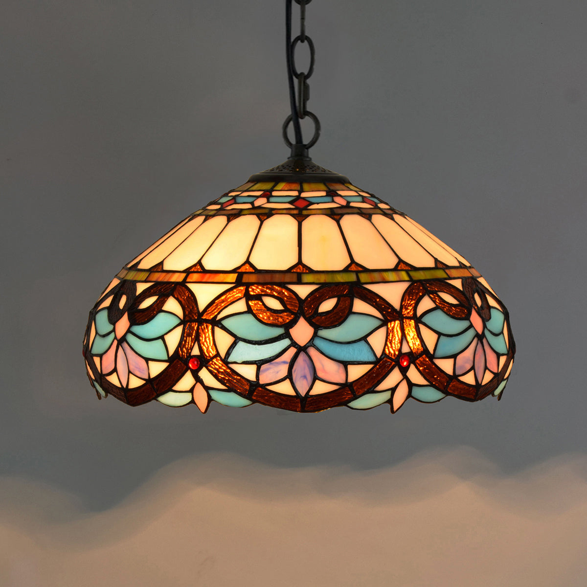 Tiffany-style stained glass pendant light in blue and pink floral design.