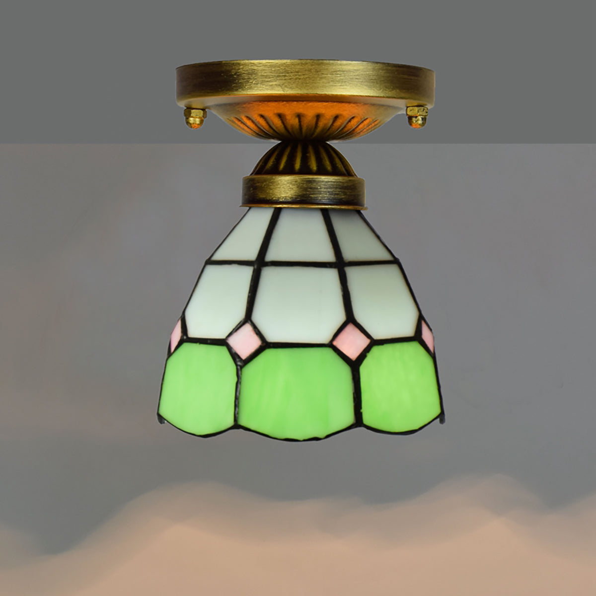 Tiffany-style stained glass ceiling light in green, white, and pink