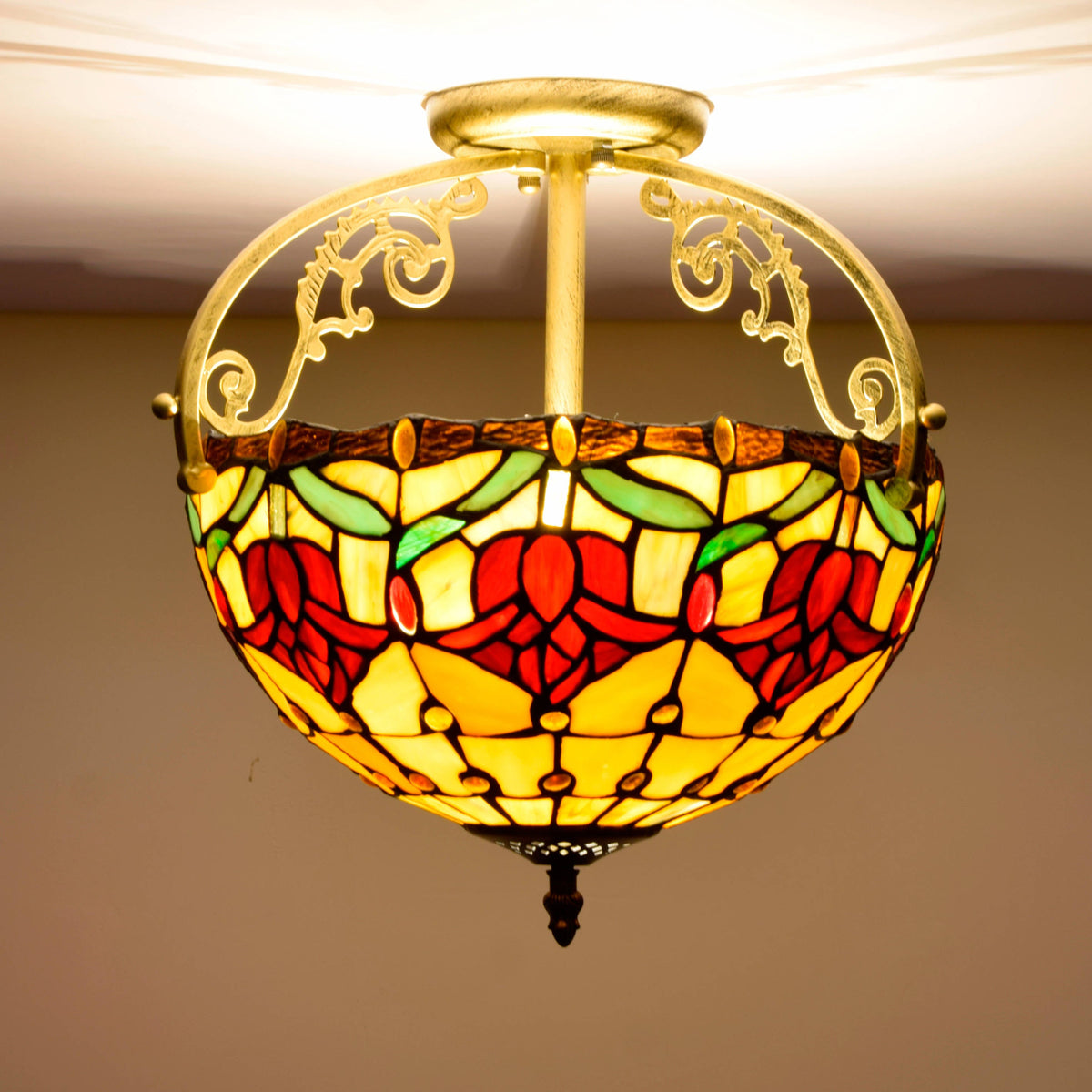 Tiffany stained glass ceiling light with sculpted metal ornaments