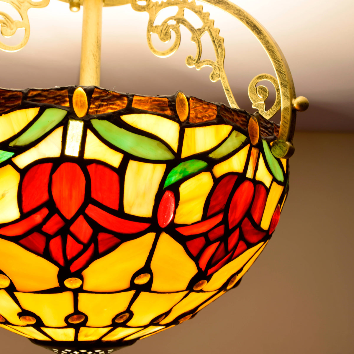 Tiffany stained glass ceiling light with sculpted metal ornaments