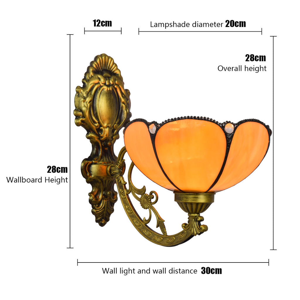 Ornate Wall Sconce in Amber Tinted Glass