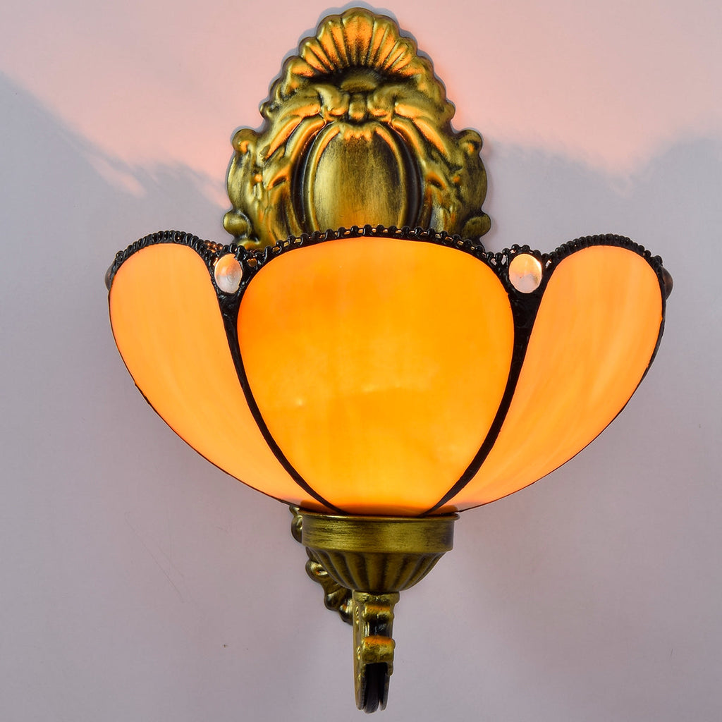 Ornate Wall Sconce in Amber Tinted Glass