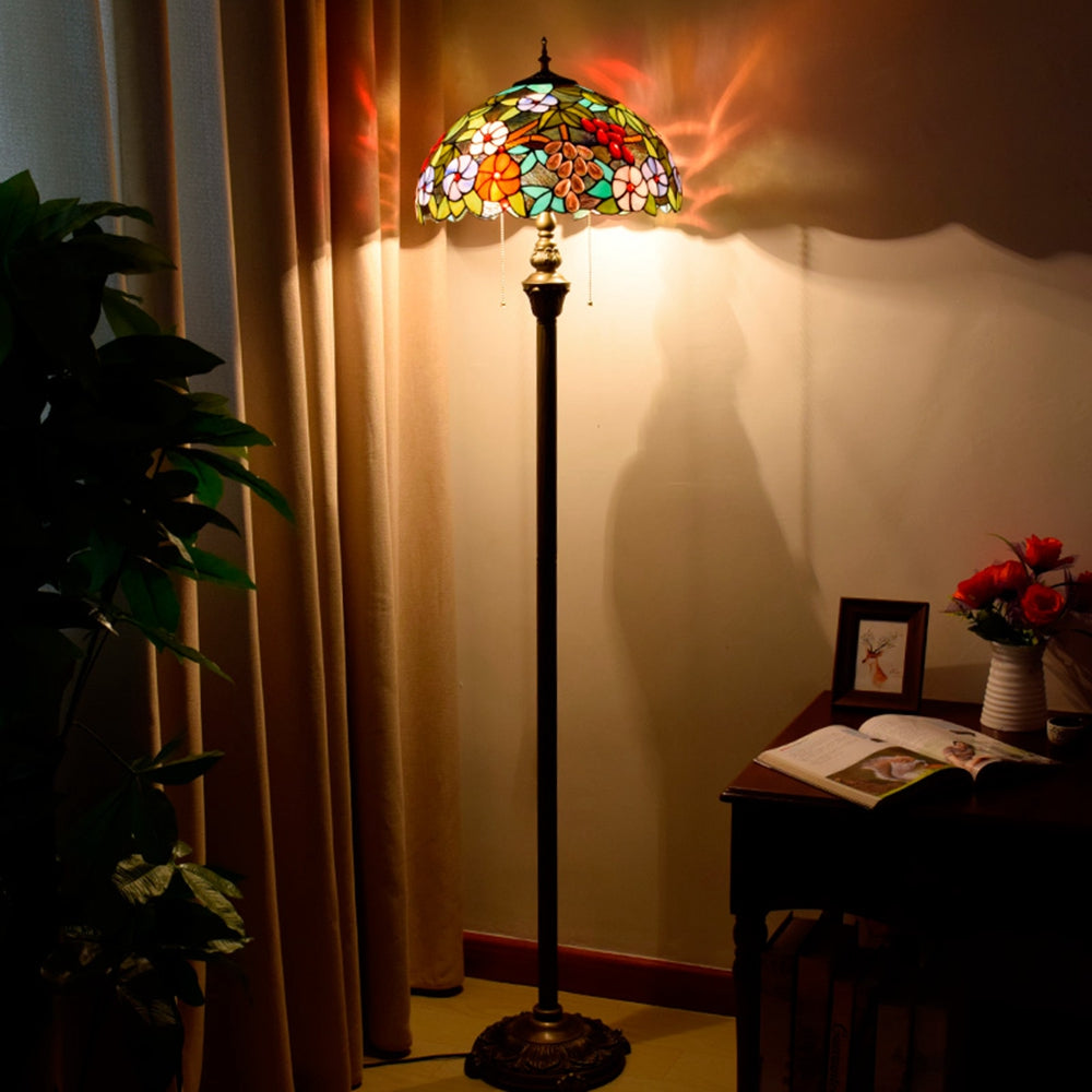 Tiffany-style lamp in stained glass with floral and grape cluster motifs