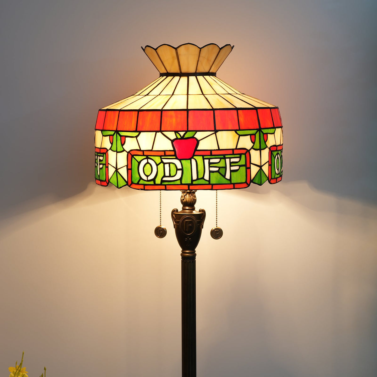 Tiffany stained glass floor lamp with apple and letter motifs