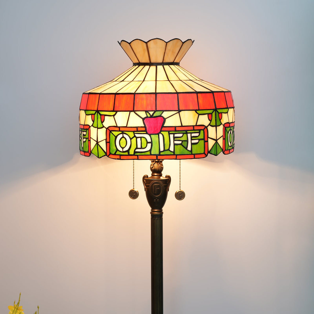 Tiffany stained glass floor lamp with apple and letter motifs