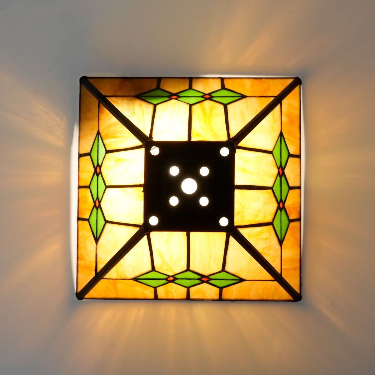 Tiffany-style glass lampshade in amber, green, and pink