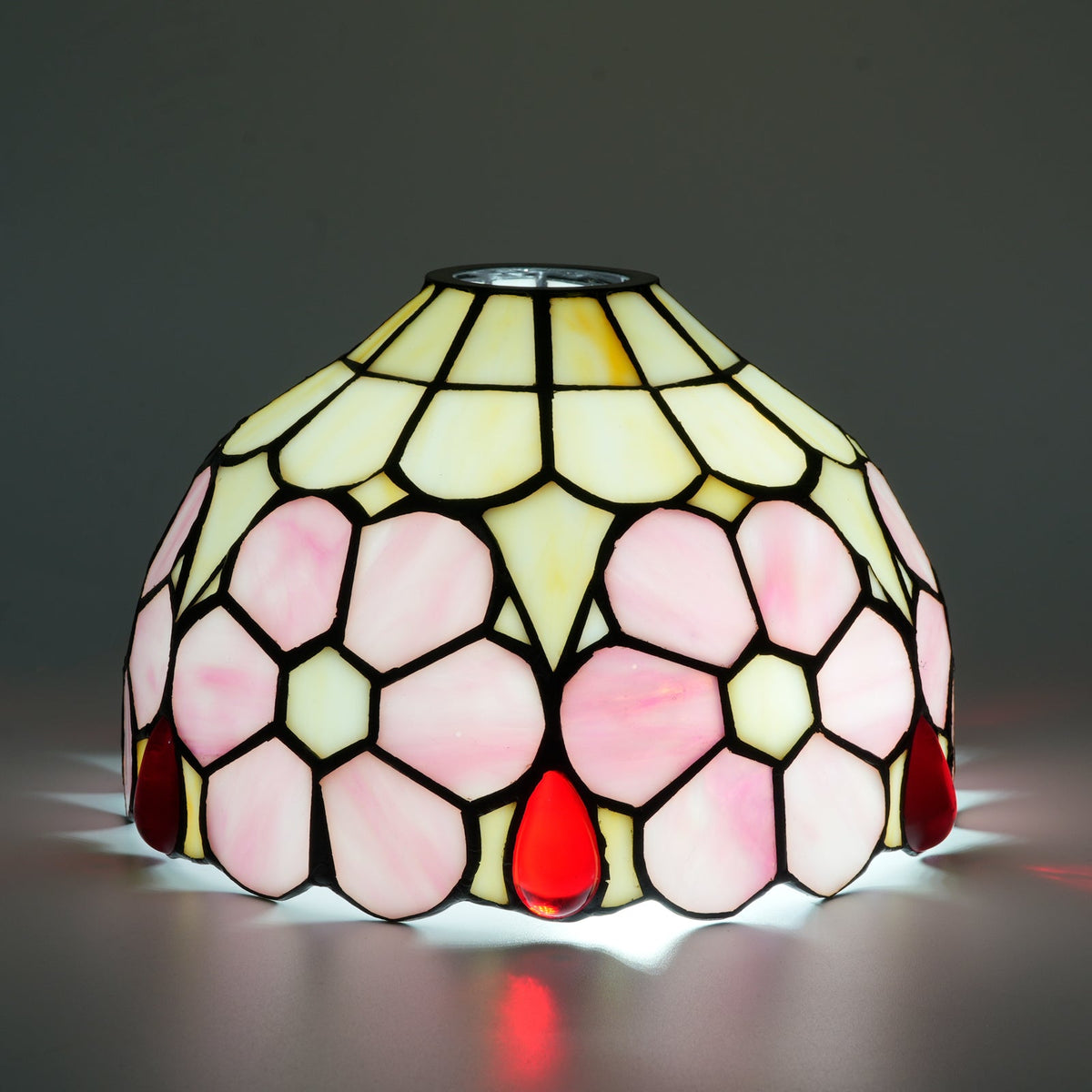 Tinted glass lampshade with pink flowers and red drops