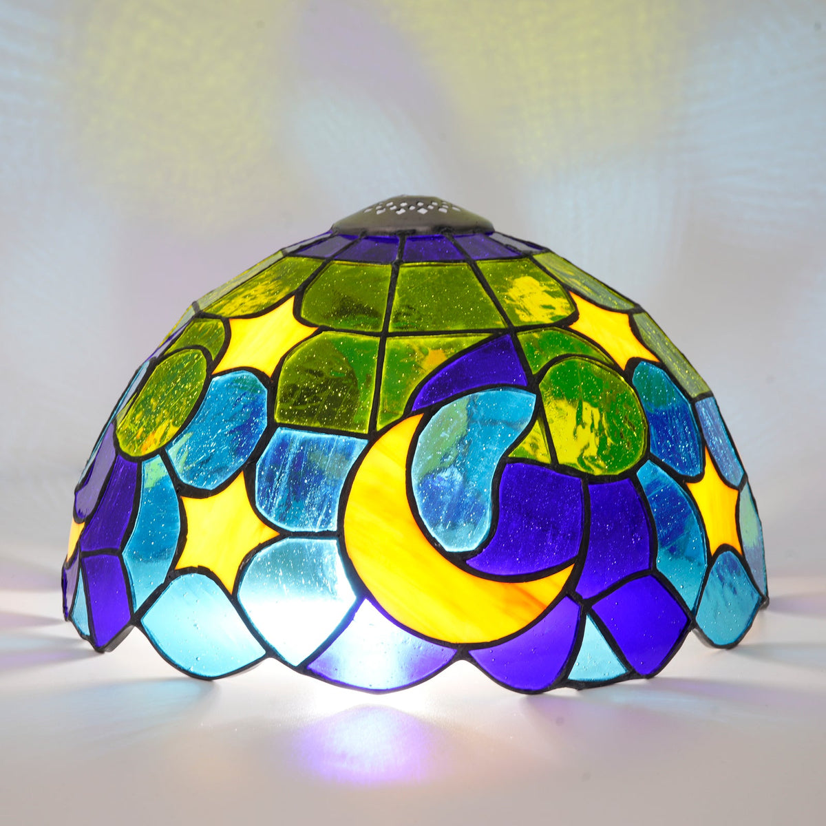 Tiffany-style stained glass lampshade with moon and stars