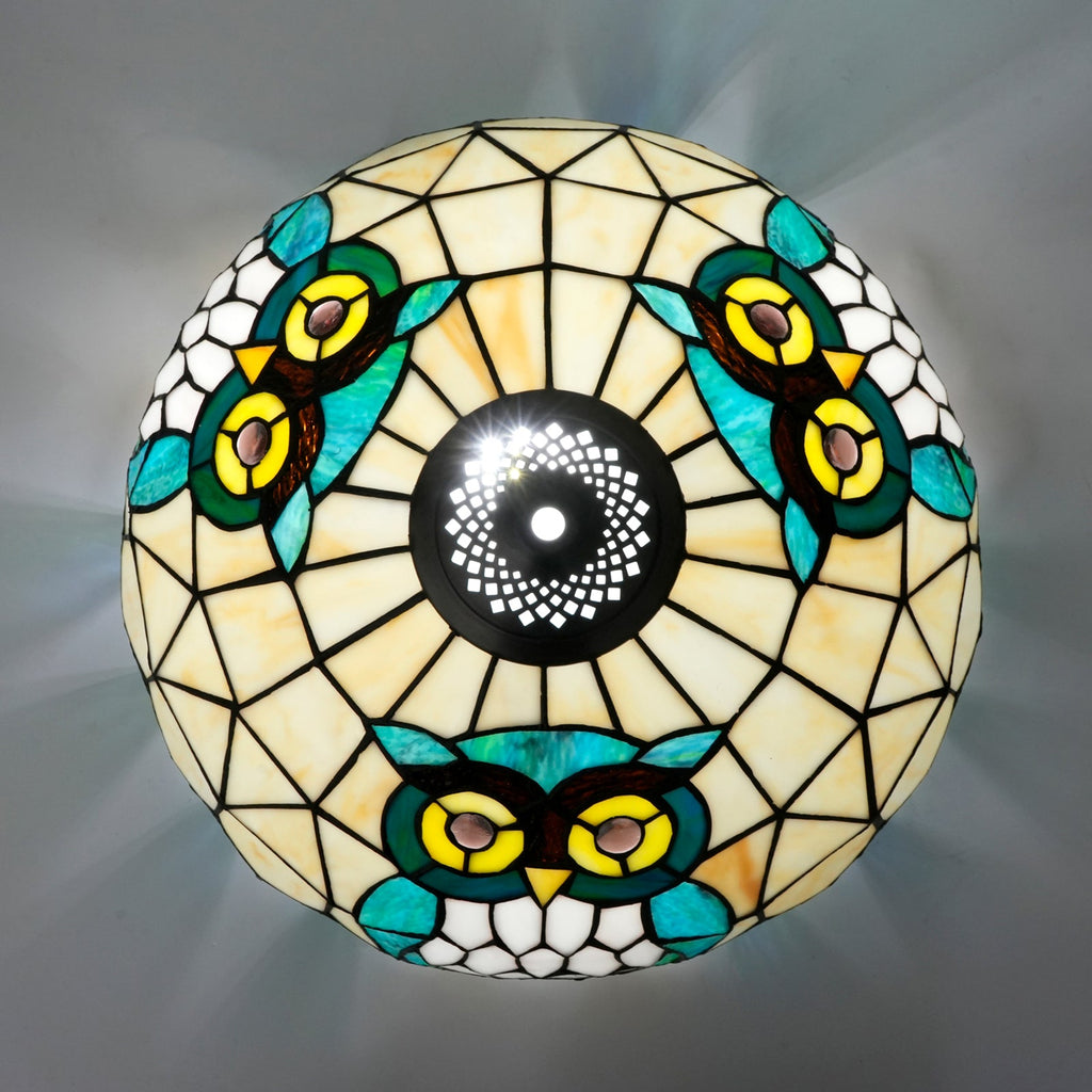 Tiffany-style stained glass lampshade with a blue-green owl design
