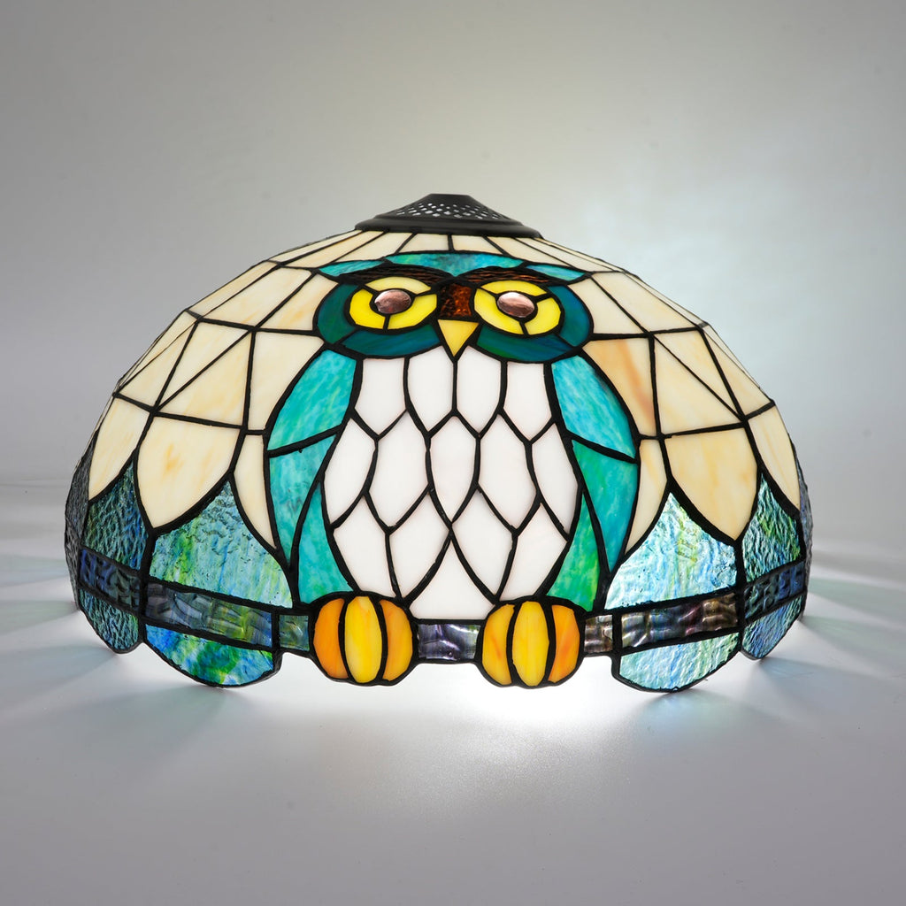 Tiffany-style stained glass lampshade with a blue-green owl design