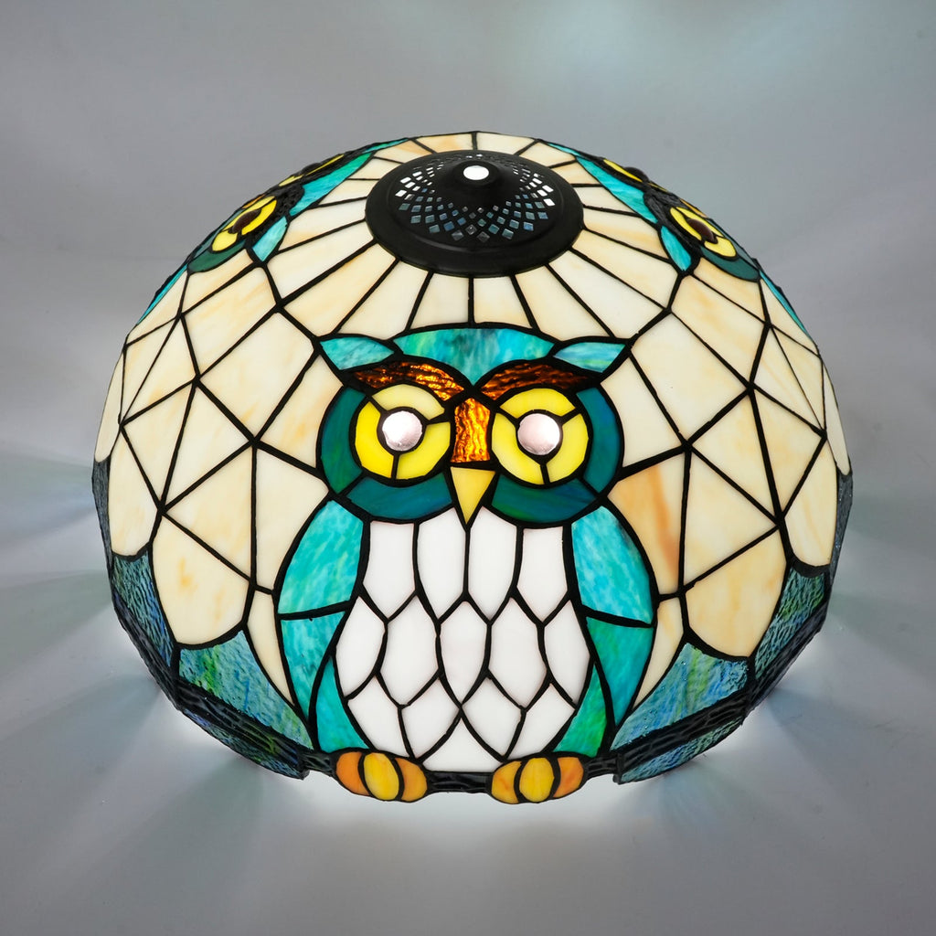 Tiffany-style stained glass lampshade with a blue-green owl design