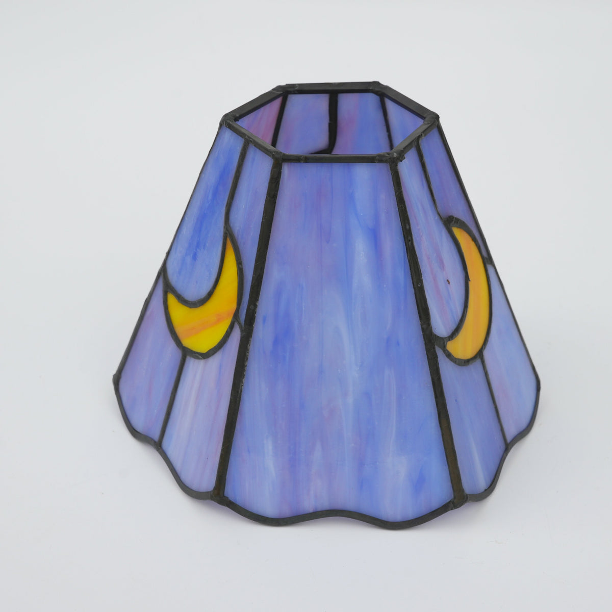 Stained glass lampshade in purple with a yellow crescent moon
