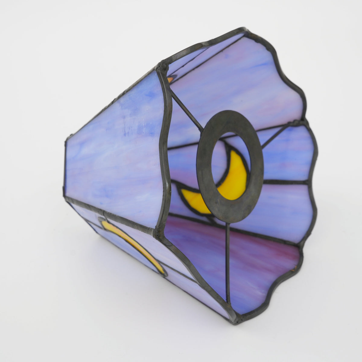 Stained glass lampshade in purple with a yellow crescent moon