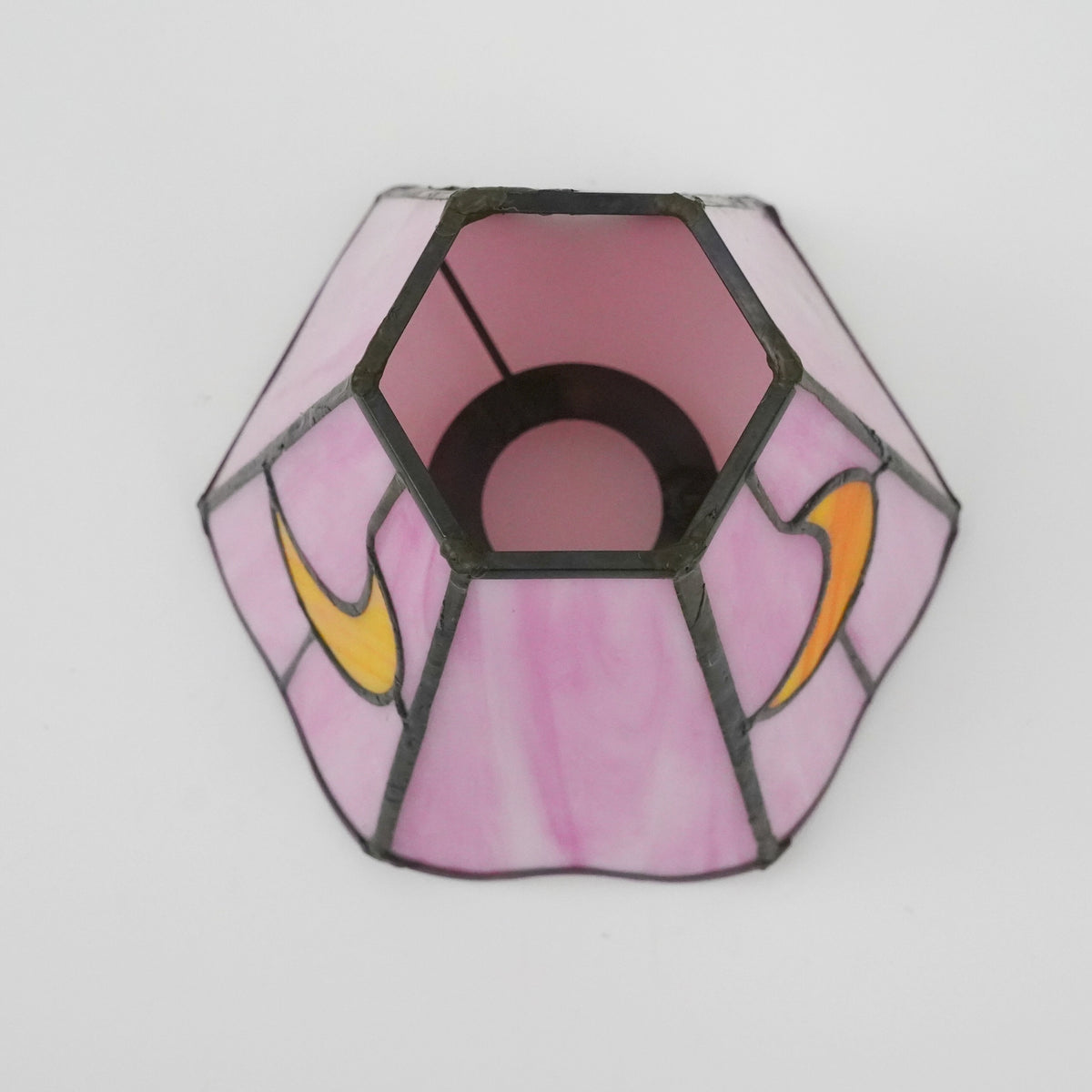 Pink tinted glass lampshade with yellow moons