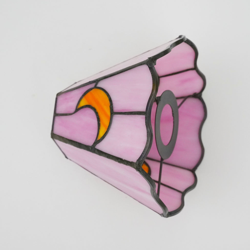 Pink tinted glass lampshade with yellow moons