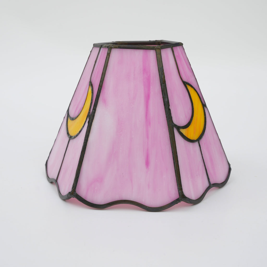 Pink tinted glass lampshade with yellow moons