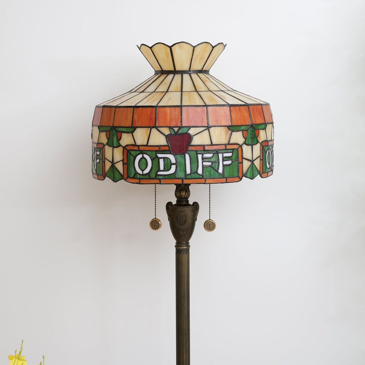 Tiffany stained glass floor lamp with apple and letter motifs