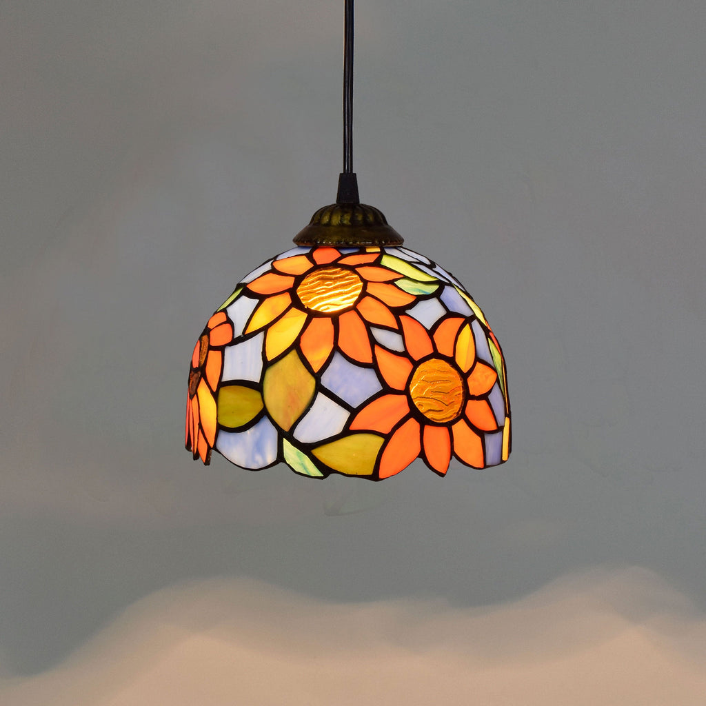Tiffany stained glass pendant light with sunflower motifs
